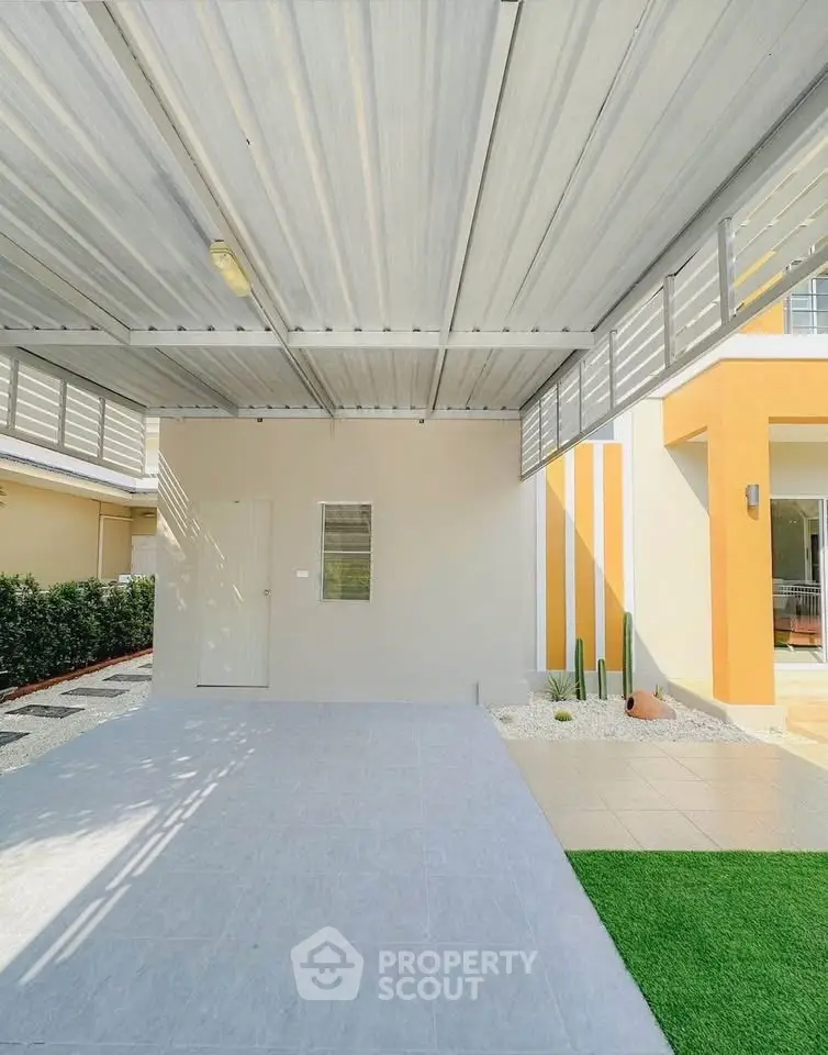 Modern carport with sleek metal roofing and minimalist landscaping