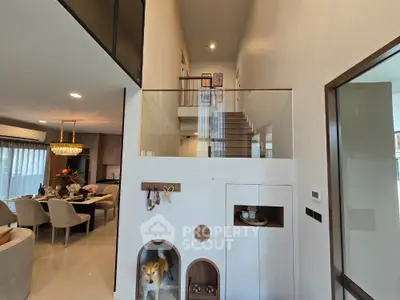 Luxurious modern home interior with elegant dining area and stylish staircase