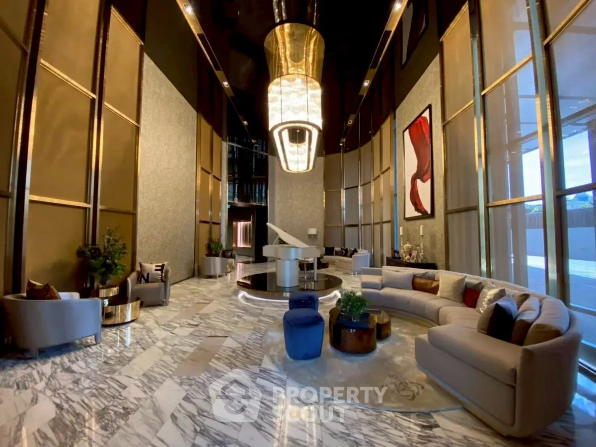 Luxurious lobby with elegant marble flooring and modern decor in upscale building