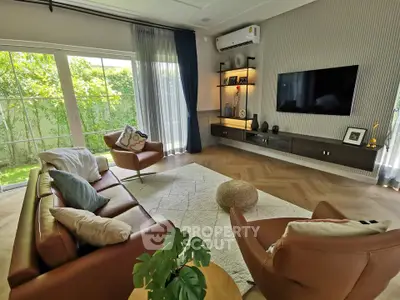 Luxurious living room with modern decor and garden view
