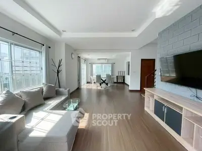 Spacious modern living room with natural light and stylish decor