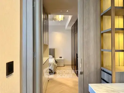 Luxurious bedroom entrance with elegant wood finishes and modern lighting