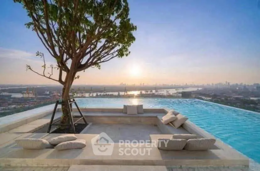 Luxurious rooftop infinity pool with stunning city skyline and sunset view.