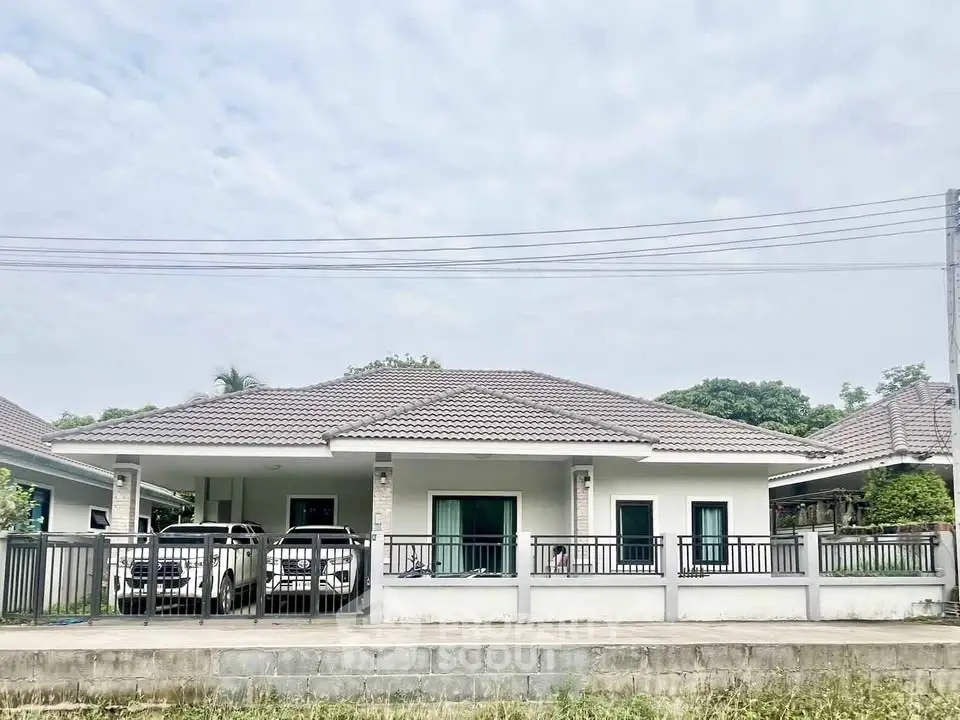 Charming single-story house with spacious driveway and modern design in a serene neighborhood.