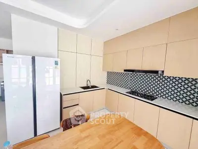 Modern kitchen with sleek cabinetry and gas stove in a stylish apartment