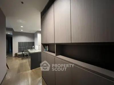 Modern kitchen with sleek cabinetry and open layout in a stylish apartment.