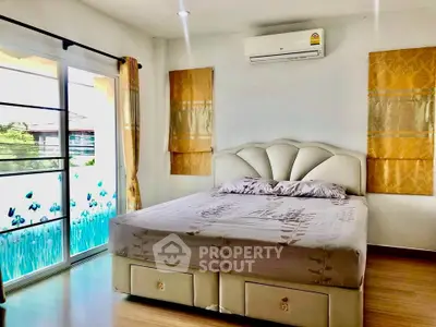 Spacious bedroom with elegant decor and large window for natural light