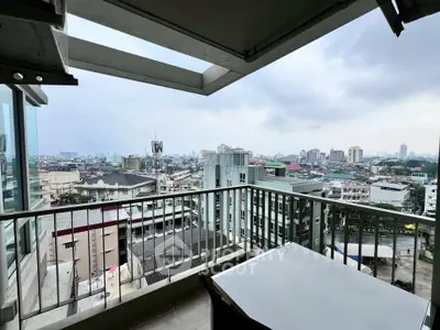 Stunning cityscape view from a modern balcony in a high-rise building.