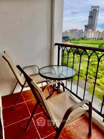 Charming balcony with city view, perfect for relaxation and enjoying the skyline.