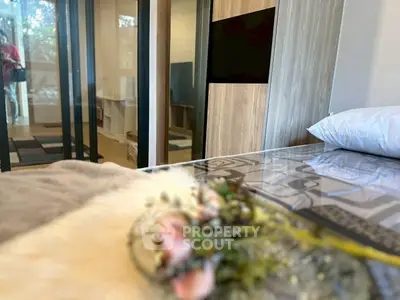 Modern bedroom with glass doors and stylish decor