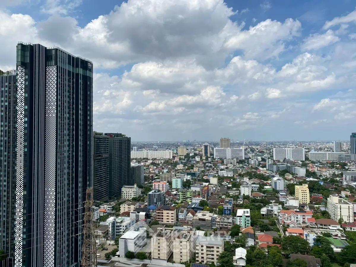 Stunning cityscape view with modern high-rise buildings under a vibrant sky.