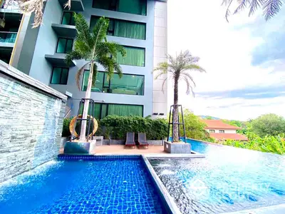 Luxurious condominium with stunning pool and lush greenery view