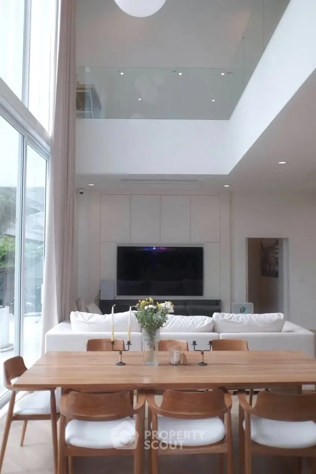 Spacious modern living room with high ceilings and elegant decor