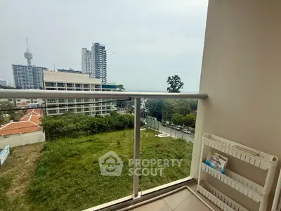 Spacious balcony with city view, perfect for relaxation and enjoying the skyline.