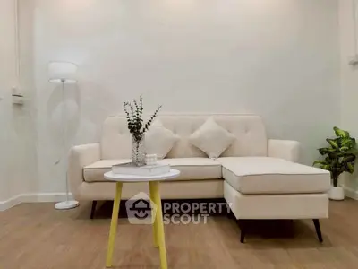 Modern living room with stylish beige sofa and chic decor