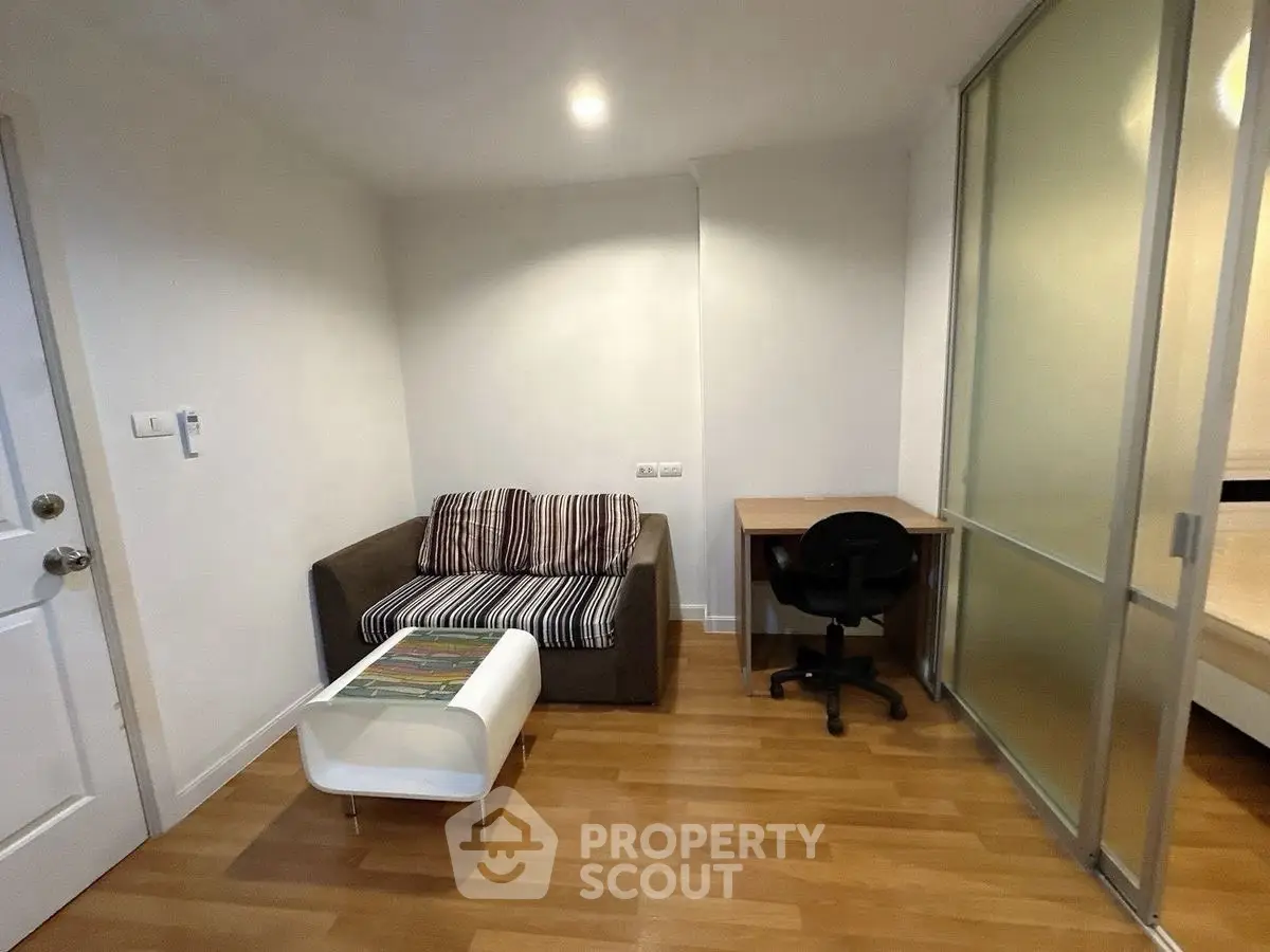 Cozy study area with modern furniture and sliding glass partition