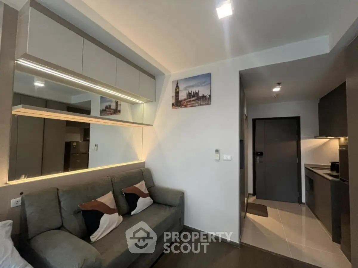 Modern living room with sleek design and cozy sofa in stylish apartment.