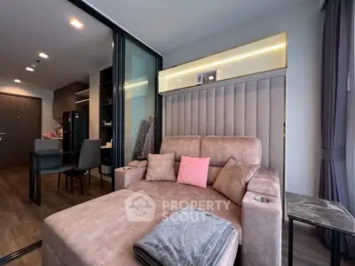 Modern living room with plush sofa and stylish decor in a contemporary apartment.