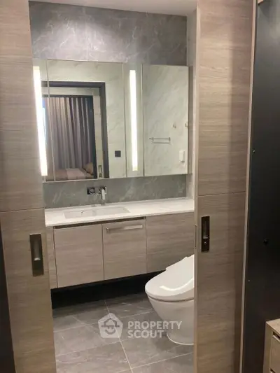 Modern bathroom with sleek design and elegant fixtures in a luxury apartment.