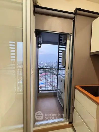 Charming apartment balcony with stunning city view, perfect for relaxation and enjoying urban skyline.