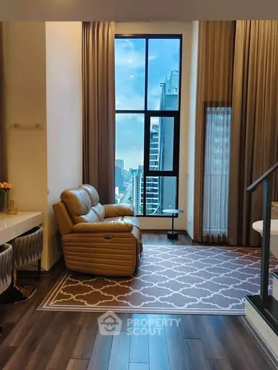Luxurious living room with high ceilings and stunning city view, featuring elegant decor and modern furnishings.