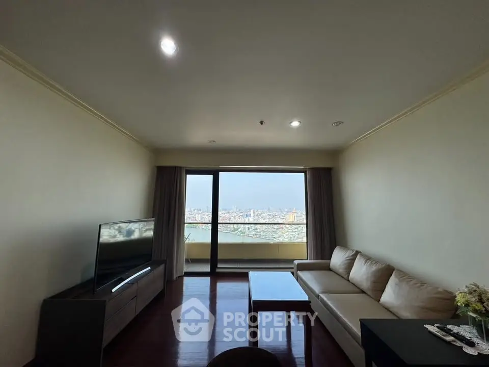 Spacious living room with stunning city view and modern furnishings