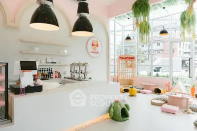 Charming pet-friendly cafe with modern decor and cozy seating in a bright, airy space.