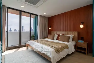 Luxurious bedroom with city view and modern decor