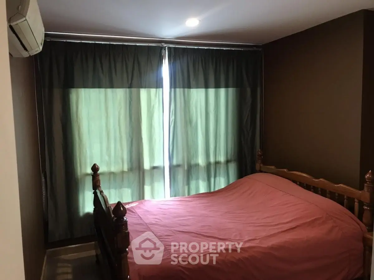 Cozy bedroom with wooden bed frame and dark curtains, perfect for restful nights.