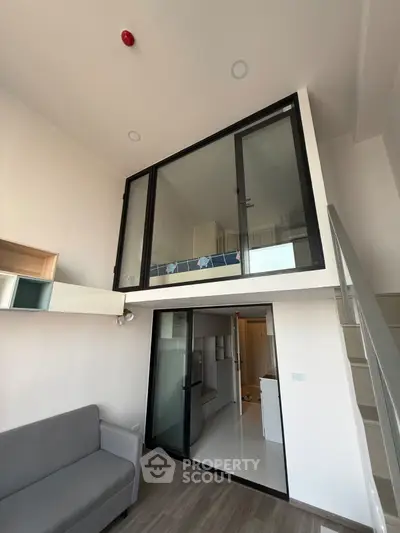 Modern loft apartment with mezzanine and sleek interior design