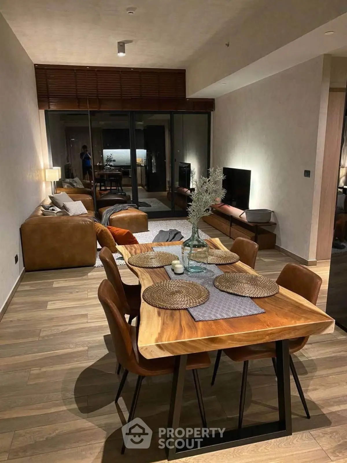 Stylish modern living room with elegant dining area and cozy seating, perfect for entertaining.