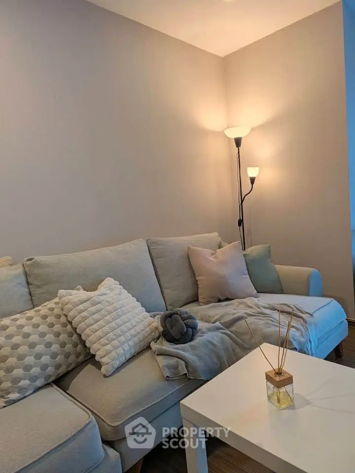 Cozy living room with stylish sofa and ambient lighting