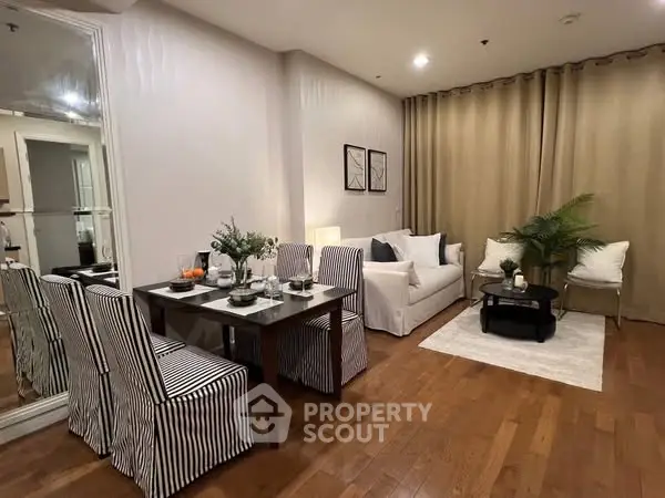 Chic living room with elegant dining area and cozy seating, perfect for modern living.