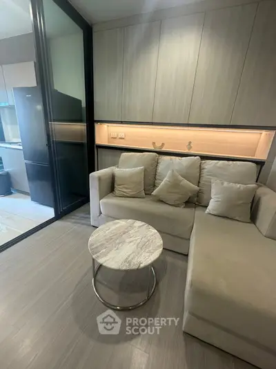 Modern living room with sleek design and cozy sofa in stylish apartment.