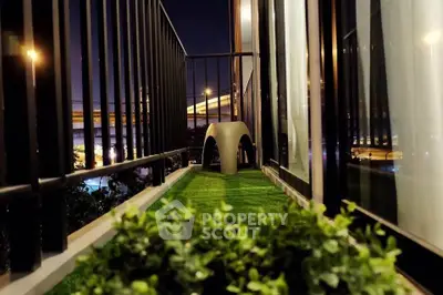 Charming balcony with artificial grass and city view, perfect for relaxation and enjoying urban living.