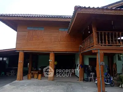 Charming traditional wooden house with elevated design and rustic balcony