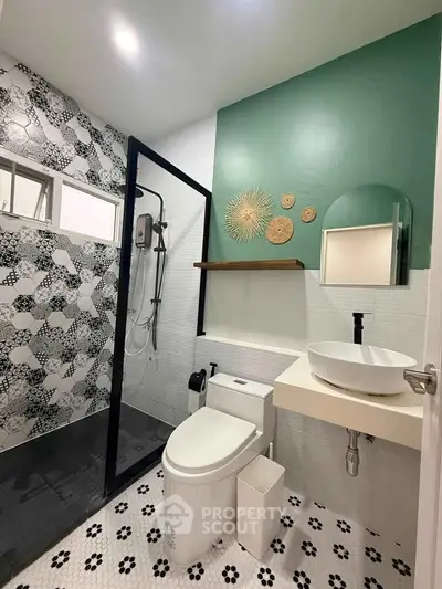 Modern bathroom with stylish tiles and sleek fixtures in a contemporary home.