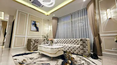 Luxurious living room with elegant tufted sofas and modern decor