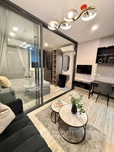 Modern living room with glass partition and stylish decor