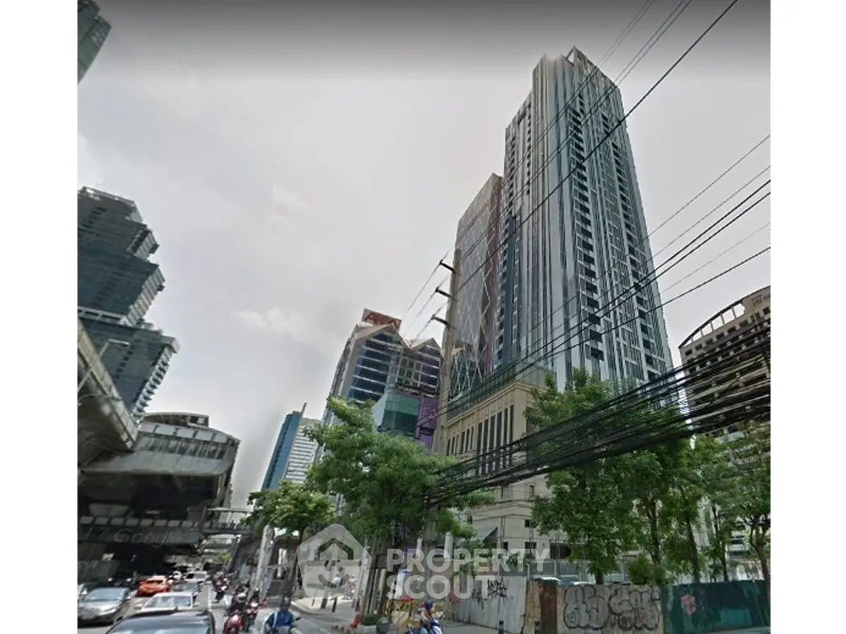 Stunning high-rise building in bustling urban setting with modern architecture and city views.