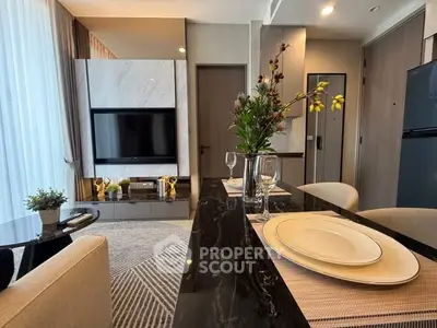Modern living room with elegant dining setup and stylish decor