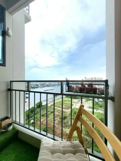 Charming balcony with scenic city and river view, perfect for relaxation and enjoying the outdoors.