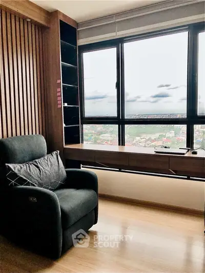 Stylish study room with panoramic city view and modern armchair