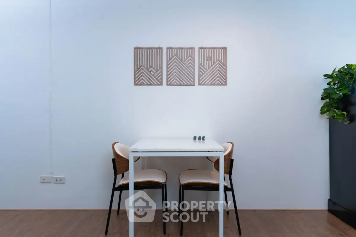 Modern minimalist dining area with stylish decor and wooden flooring