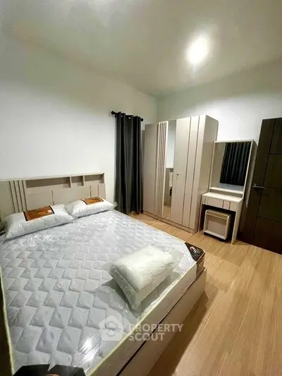 Modern bedroom with sleek furniture and cozy ambiance