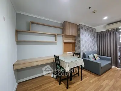 Cozy living room with modern decor, wooden flooring, and stylish furniture, perfect for relaxation and entertainment.