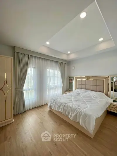 Luxurious bedroom with elegant decor and natural light