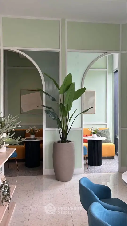 Stylish modern living room with vibrant furniture and indoor plants