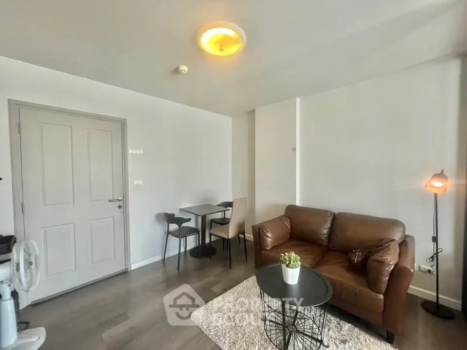 Cozy living room with leather sofa and modern decor