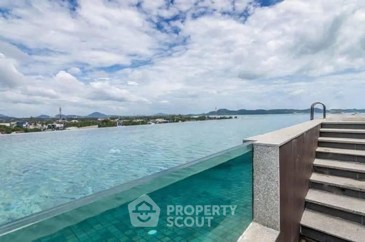 Stunning rooftop infinity pool with panoramic city and mountain views